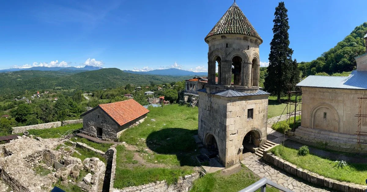 A view of ancient Georgia monastery complex with many buildings some under renovation.
