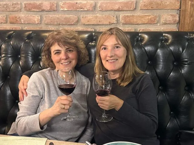 Two woman enjoying a glass of Georgian Red Wine