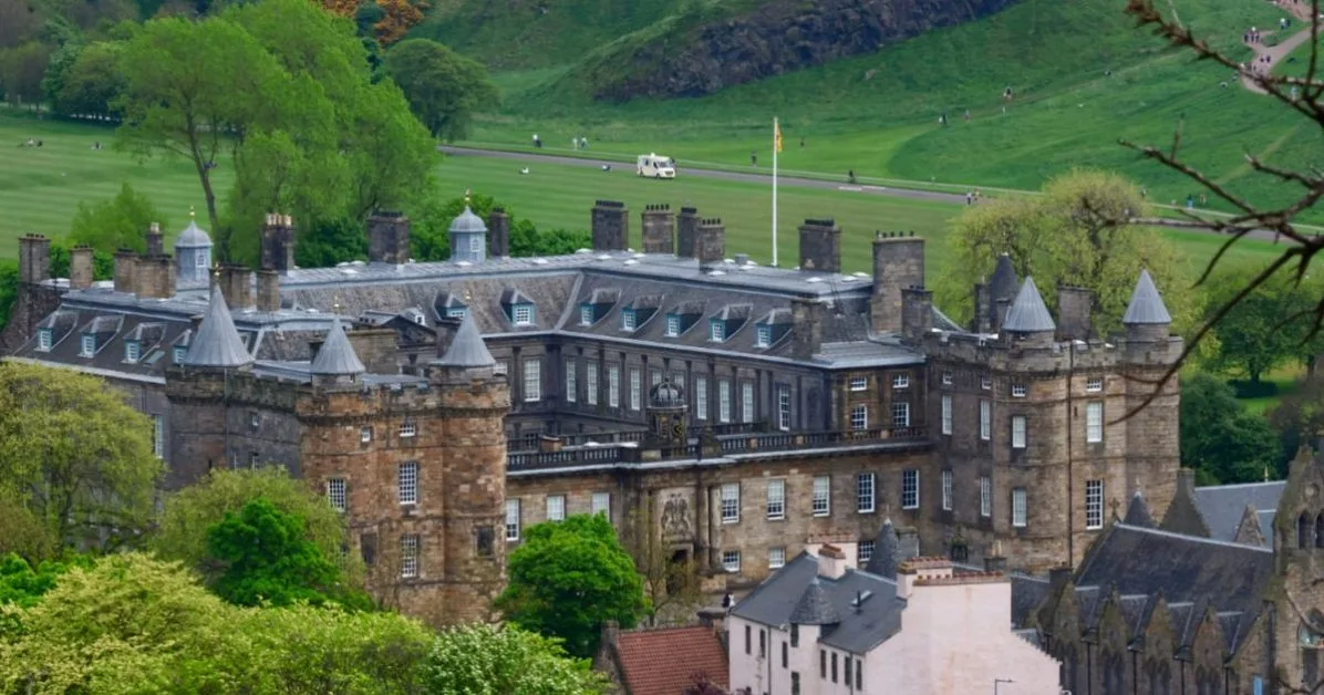 A stone and slate roofed building which is the Palace of Holyrood in Edinburgh.