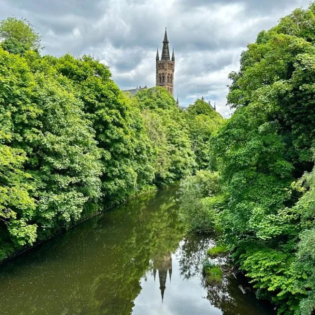 River Kelvin in Glasgow is surrounded by trees in full leaf.