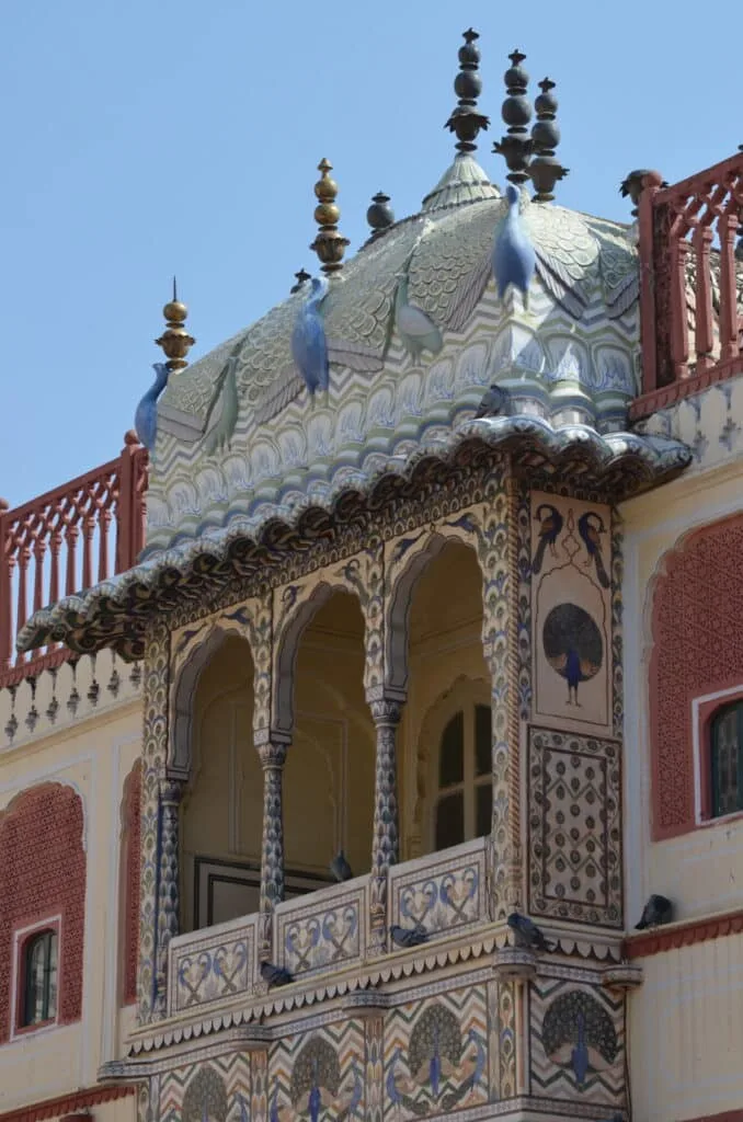 The exterior of an ornate painted building in Jaipur India.