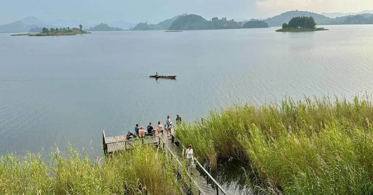 People enjoying views over Lake Mutanda as sun starts to set