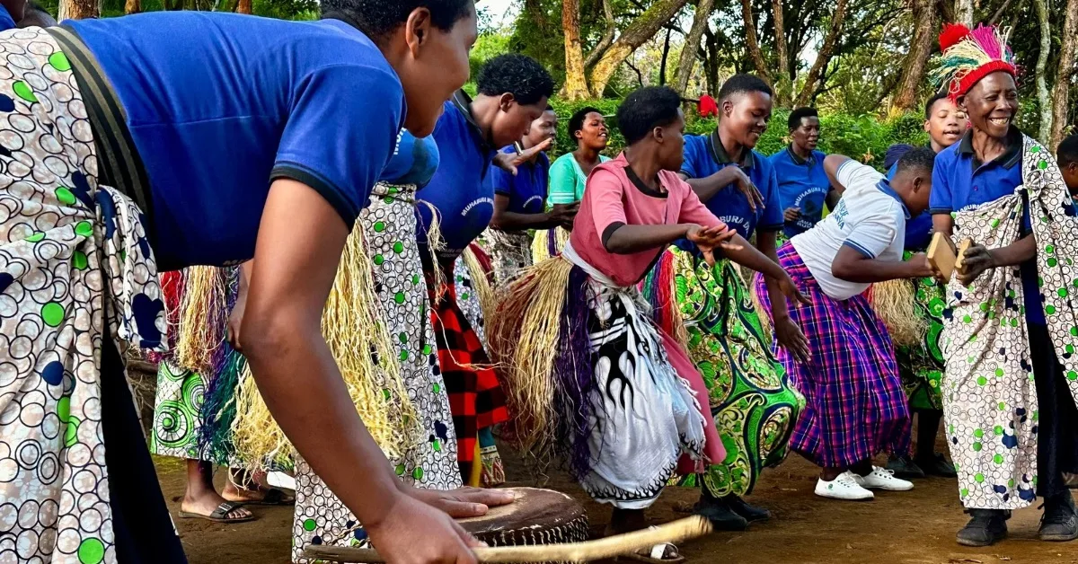 Local residents perform traditional songs and dancing at Mgahinga National Park base camp.