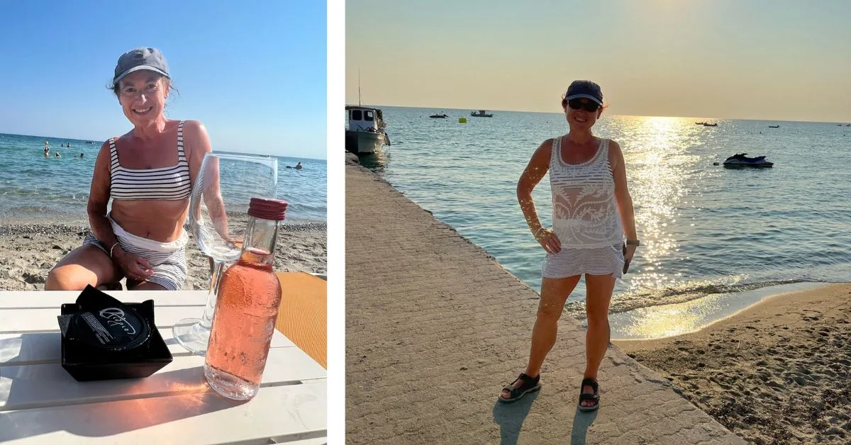 Woman on the beach as the sun goes down enjoying a glass of wine