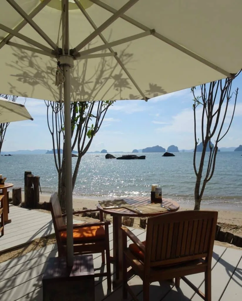 Restaurant on a beach in Krabi with views out over the ocean.
