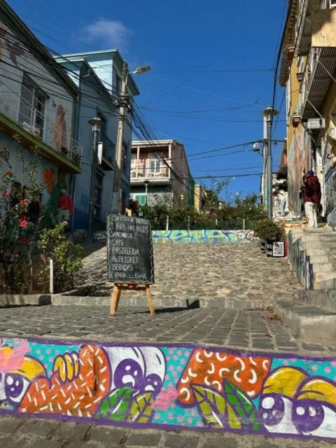 Steps take you from one level to another in Valparaiso city, Chile. Street graffiti brings colour to the grey steps.