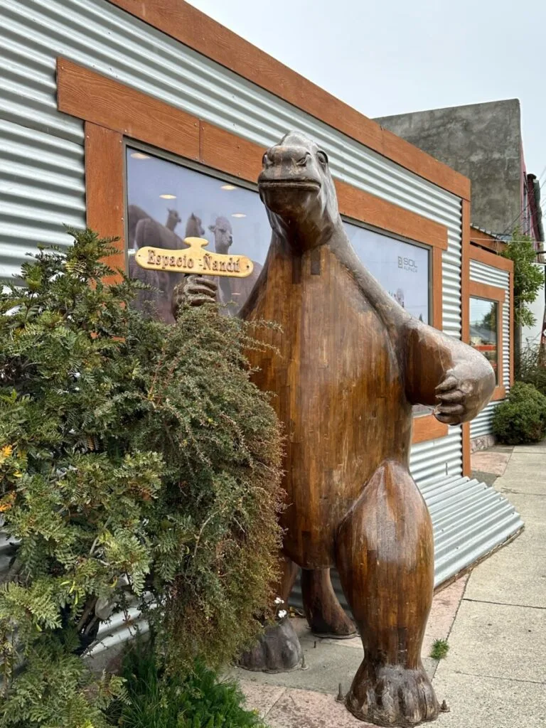 Bear carved out of wood outside a gift shop in Puerto Natales, Chile.