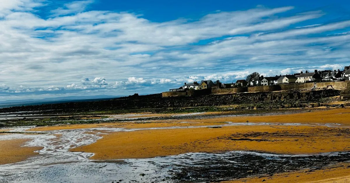 Low tide in the bay outside harbour and town of Anstruther Fife.