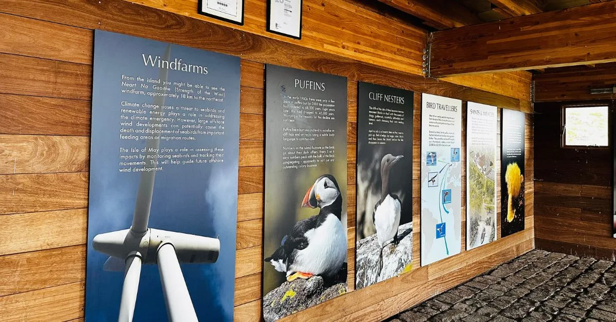 Interior of Isle of May Visitors Center with information boards on puffins, cliff nesting birds and walking routes.