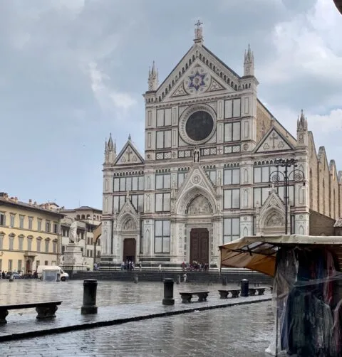 Florence is a must stop on any Tour of Italy. This main square has a church with ornate decor.