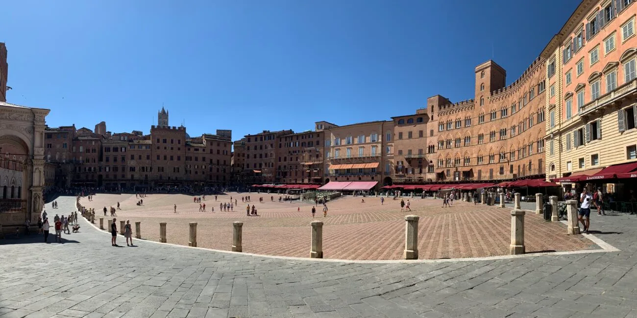 The huge square (piazza) in Siena where centuries old horse racing still occurs. The area is circular like a race-track.