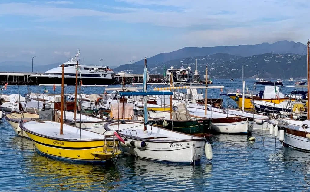 The main arrival area on island of Capri where many boats are anchored.