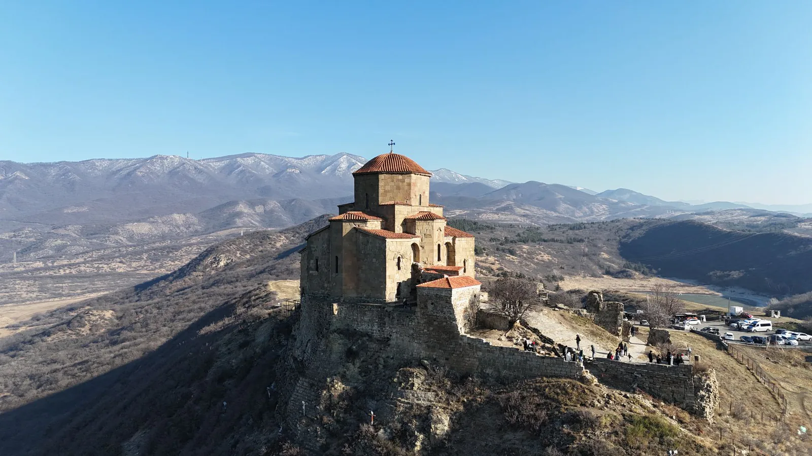 Jvari Monastery perched on a hilltop near Mtskheta, Georgia, surrounded by mountains