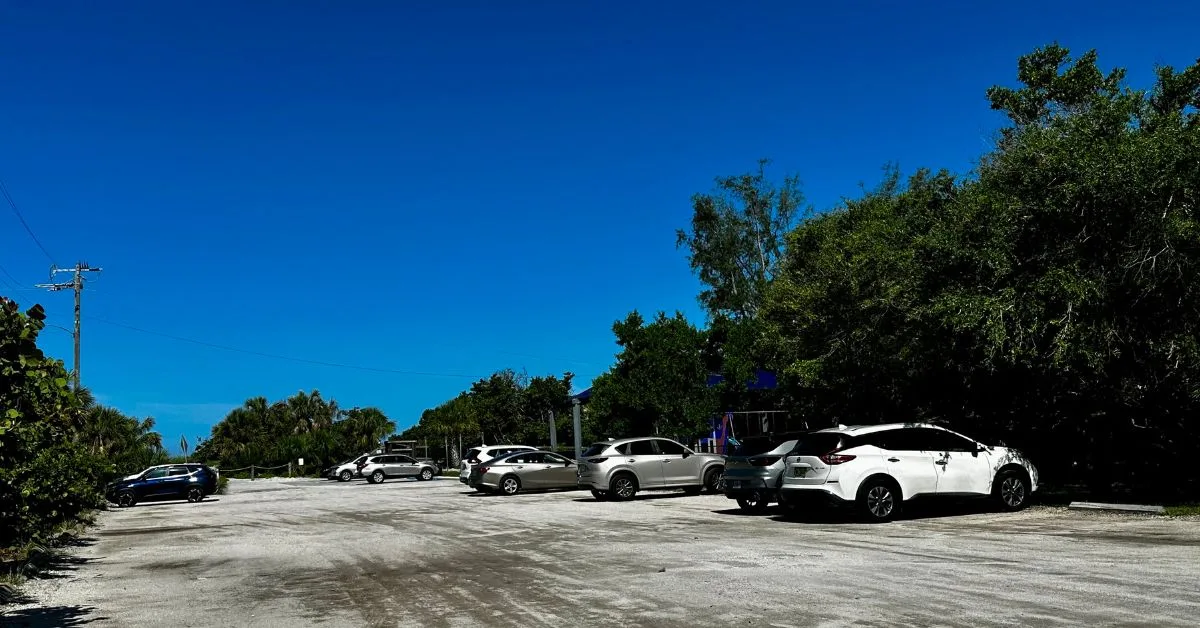 Cars parked at a beach car park on Siesta Key.