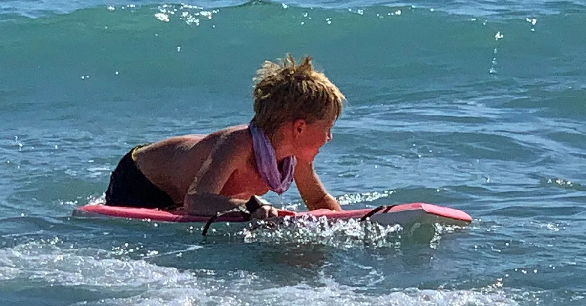 Kid boogie boarding.