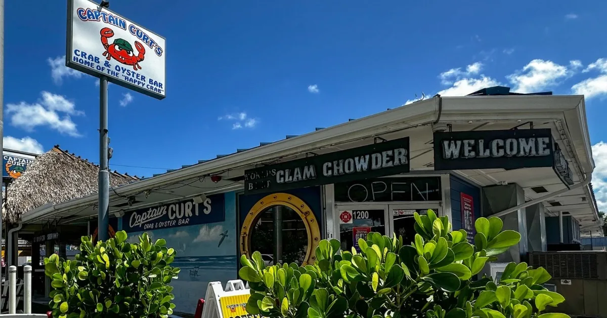 Sign with a picture of a crab advertising a clam chowder restaurant on Siesta Key.