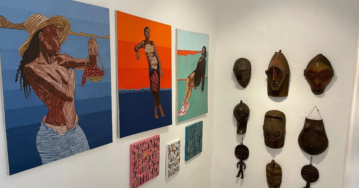 Artwork on display in including painting and masks.