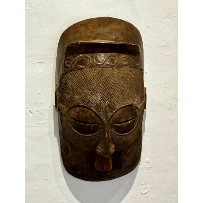 Traditional Rwandan Mask hanging on a Wall.