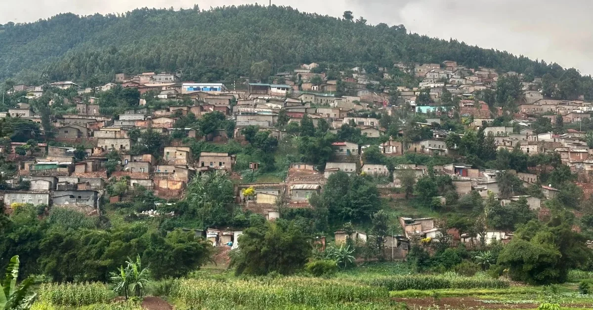 View of rural Rwanda homes built on hillsides.