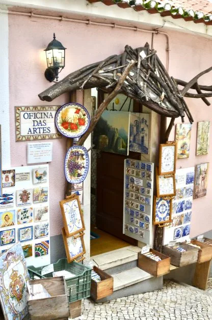 Ceramic plates and tiles decorate the entrance to an arts shop in Sintra, Portugal.