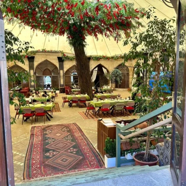 Carpet and dining tables interior of Shakh Garden in Baku.