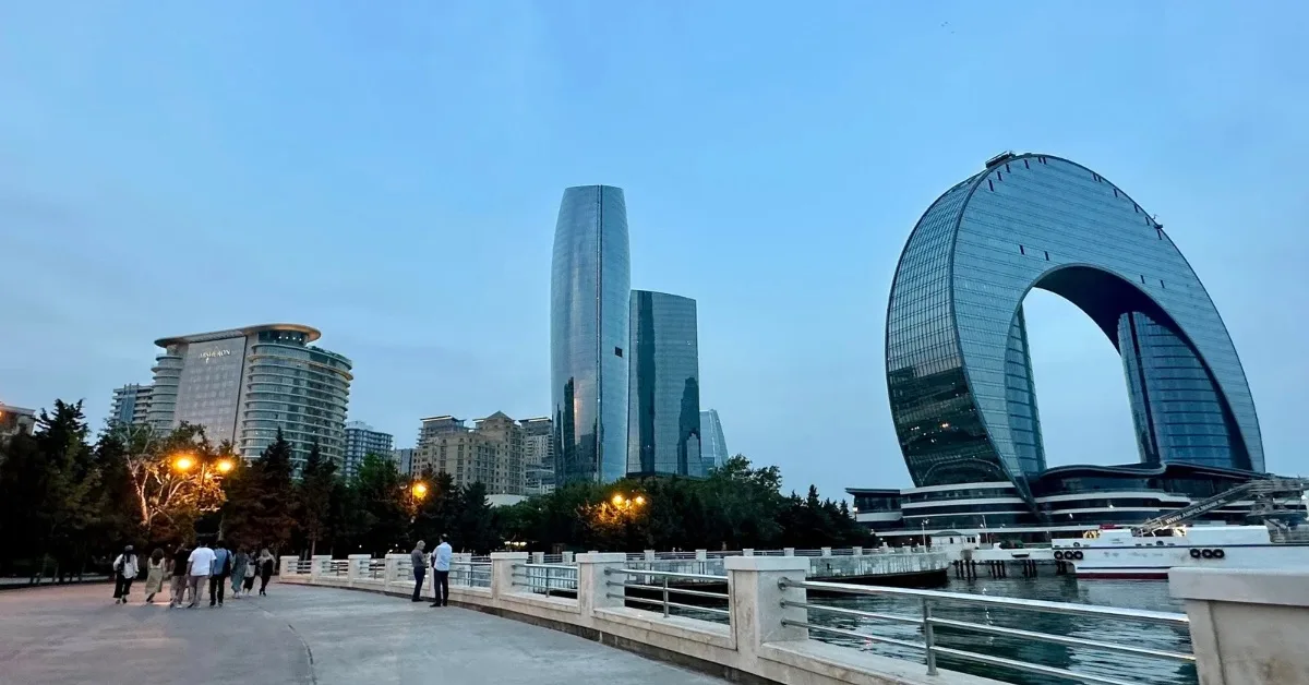 Port Baku circular building on the Baku Boulevard walkway popular with residents.