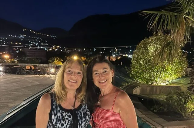 Two women in Caveat heading out to dinner in the evening.