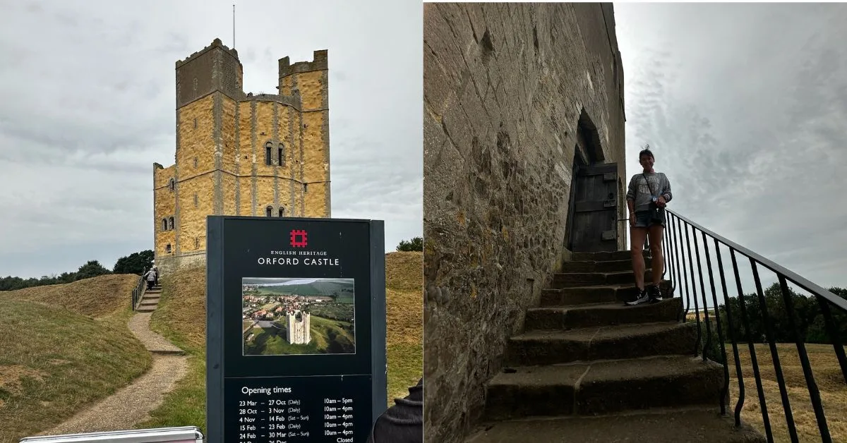 Full image of Orford Castle with sign showing opening times and a woman standing of the steps to entrance