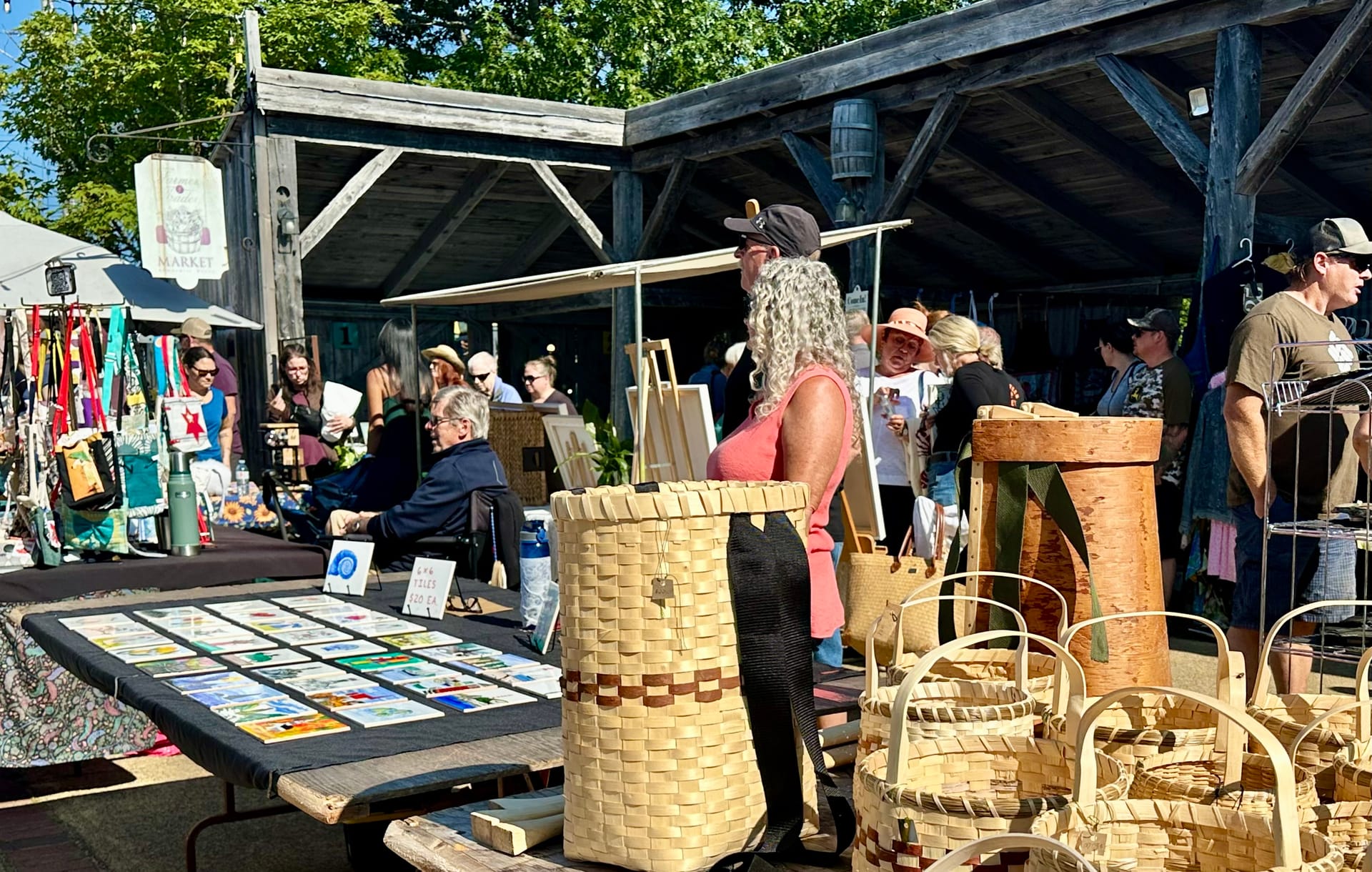 Artisans market stalls with handmade baskets at Annapolis Royal farmers market
