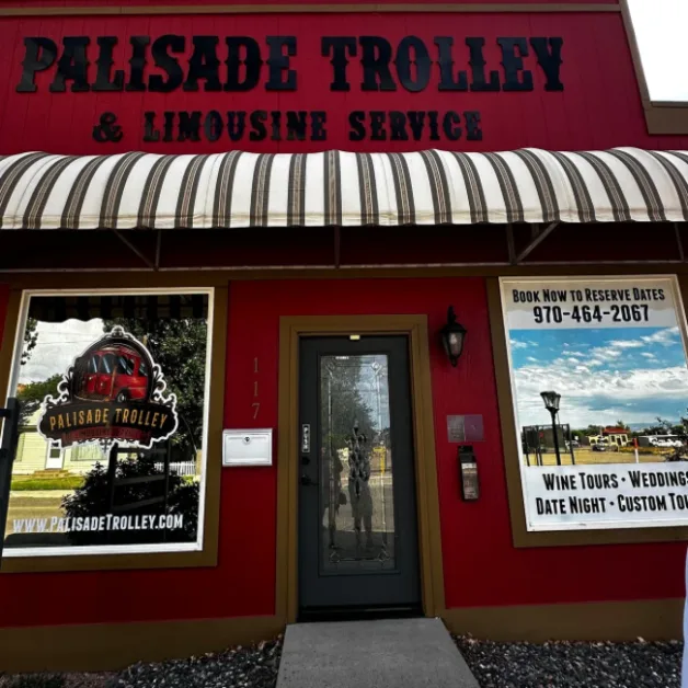 An office advertising Palisade Trolley and Limo tours in Palisade Colorado.