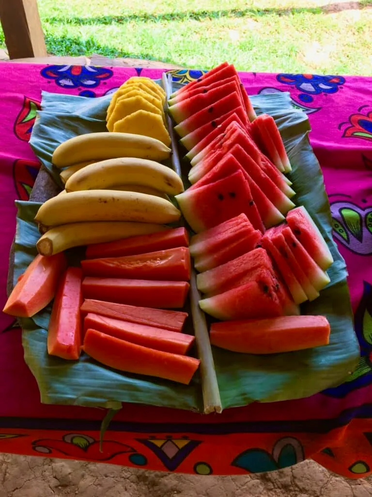 Fresh fruits on a tray in a village near Panama City, Panama. Watermelon, banana and pineapple cut fruits are displayed.
