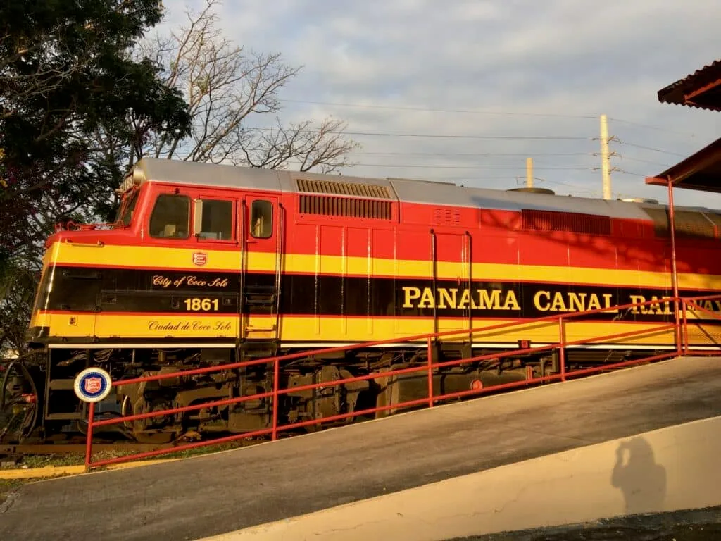 A red and orange painted Panama Canal Railway which takes tourists across the country.