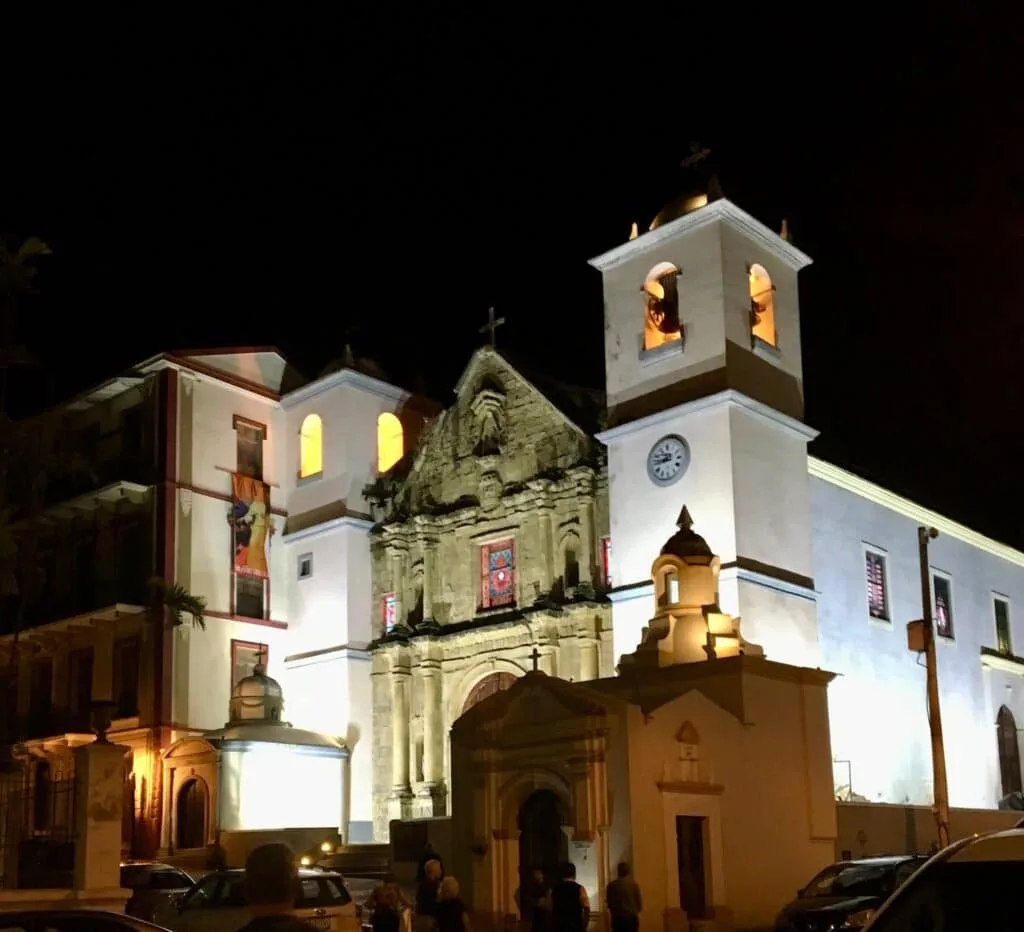 Convent Santo Domingo in Panama City, Panama lit at night showing the original building and later additions in a white brick.