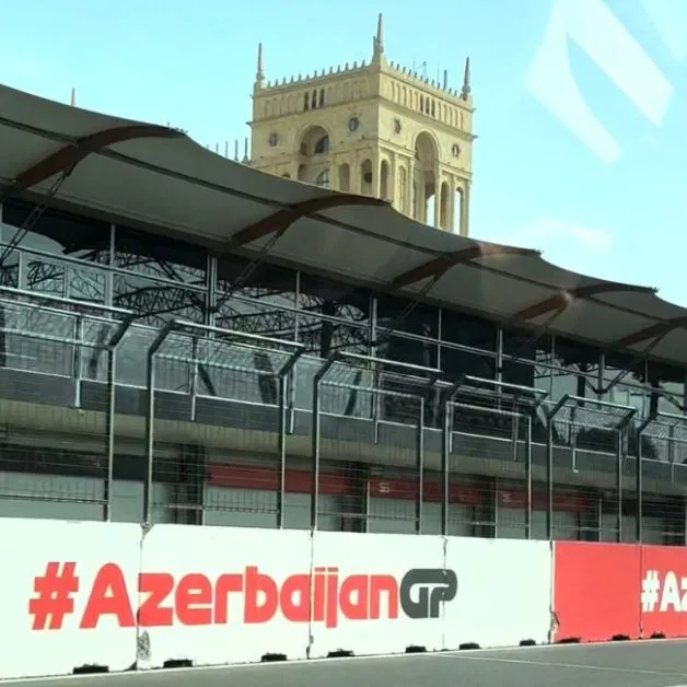 This is the viewing section of the F1 Azerbaijan Grand Prix in Baku. Behind is an ancient brick building with an ornate tower. The Grand Prix is one of the major reasons to visit Azerbaijan in September.