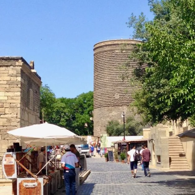 Reasons to Visit Azerbaijan are evident in this photo of the ancient Maiden tower and old city trading area.