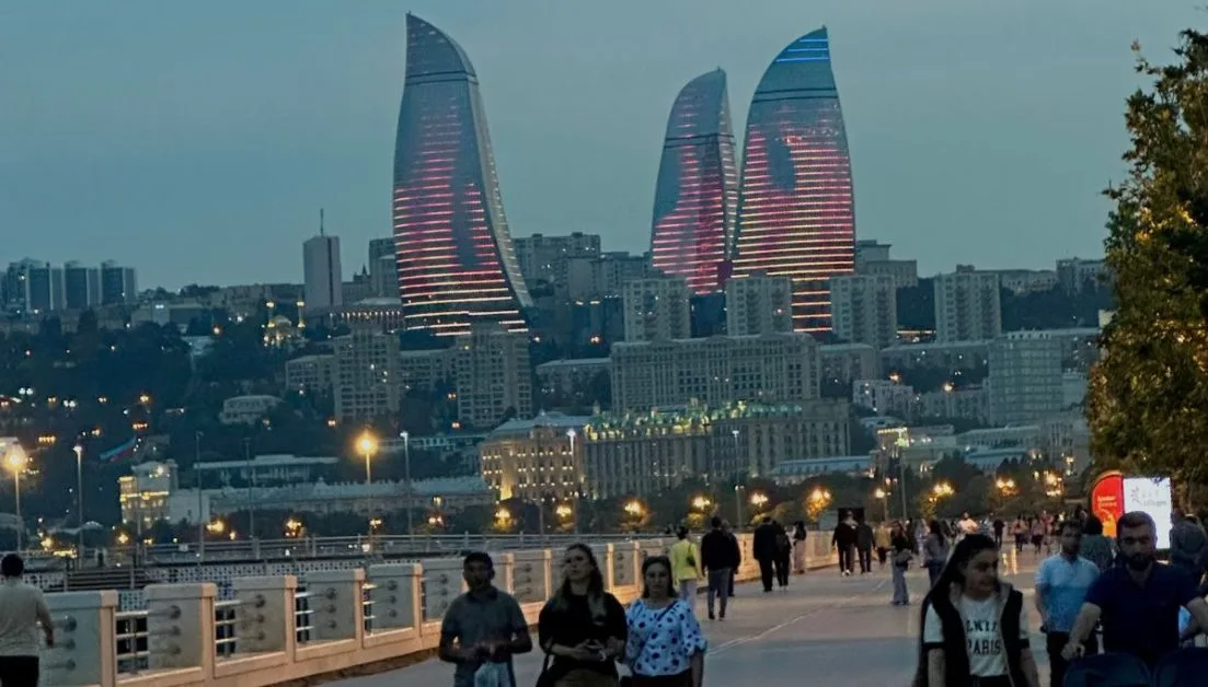 One of the reasons to visit Azerbaijan is to explore the modern capital Baku. In this photo you can see 3 glass towards rising above the city skyline, each with LED lights that reflect a flame.