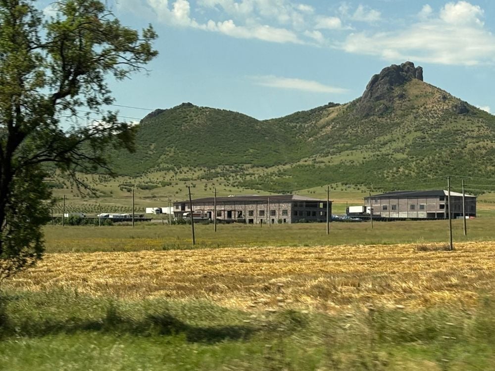 Rural farm landscape and mountains after the Georgia-Armenia border crossing