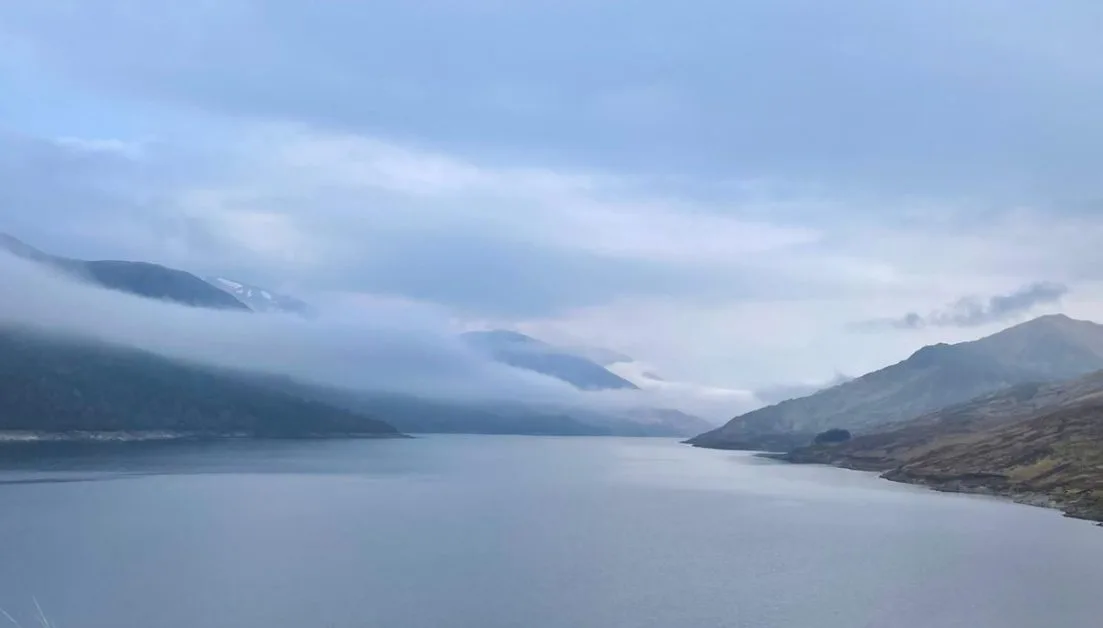 Mist over the hills and glen on a Scottish loch.