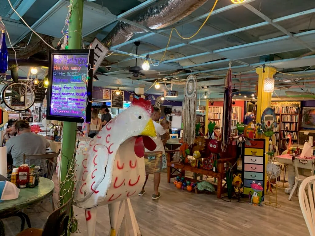 A large cockerel and other characters decorate the interior of a coffee and lunch cafe on Anna Maria Island Florida.