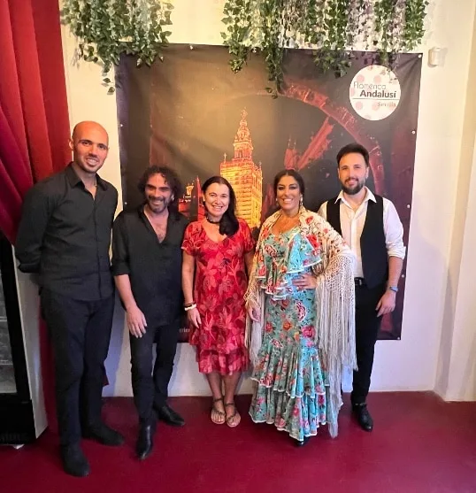 Blogger Ruby is standing with professional flamenco dancers.