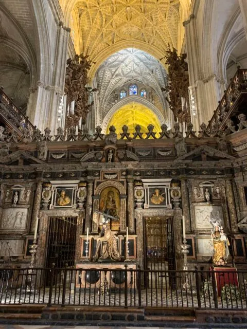 Altar area and dome ceiling inside Seville Cathedral.