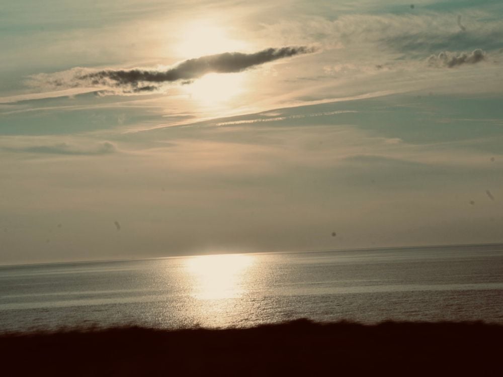 Sun setting over the ocean near Chéticamp on the Cabot Trail, Cape Breton