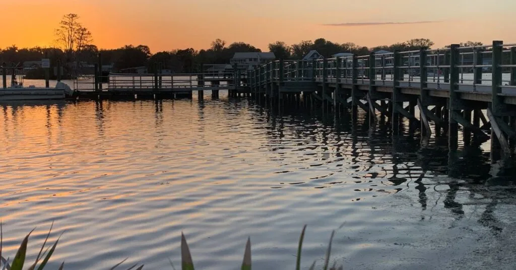 Sunset sky of orange over a dock in Crystal River Florida.