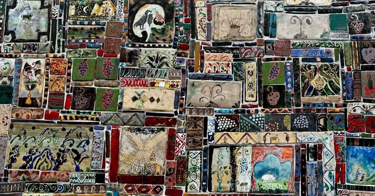 Decorative tiles on the Gabriadze Clock showing scenes from life around Georgia.