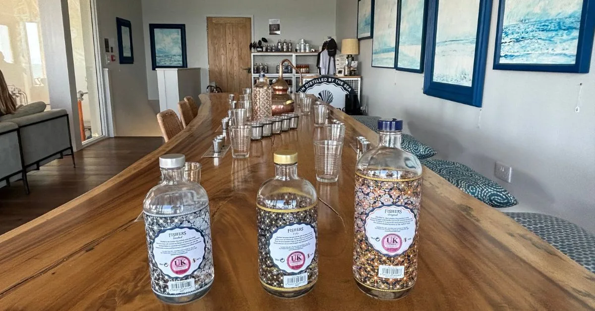 Bottles of gin on a table at Fishers Gin in Aldeburgh - this is part of a gin tasting tour.