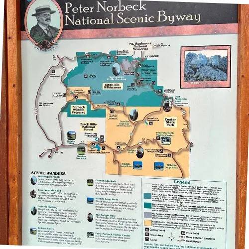 Information board and map of Peter Norbeck Highway, one of the top unique things to do in Black Hills South Dakota.