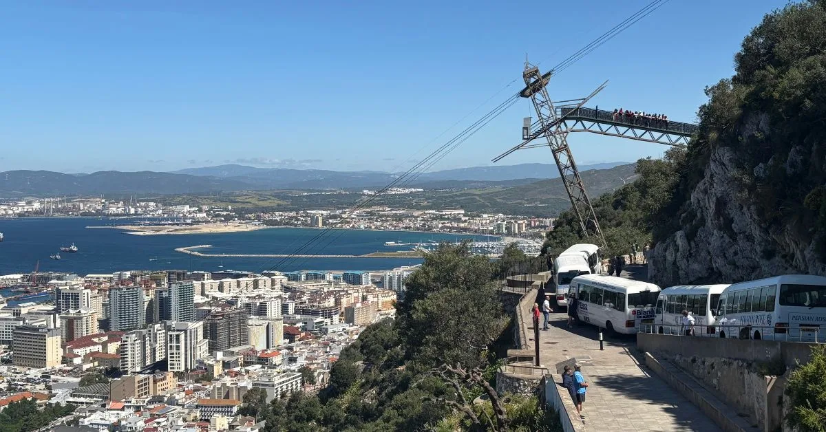 View of Gibraltar from the upper rock with your buses parked up and the cable car in the background