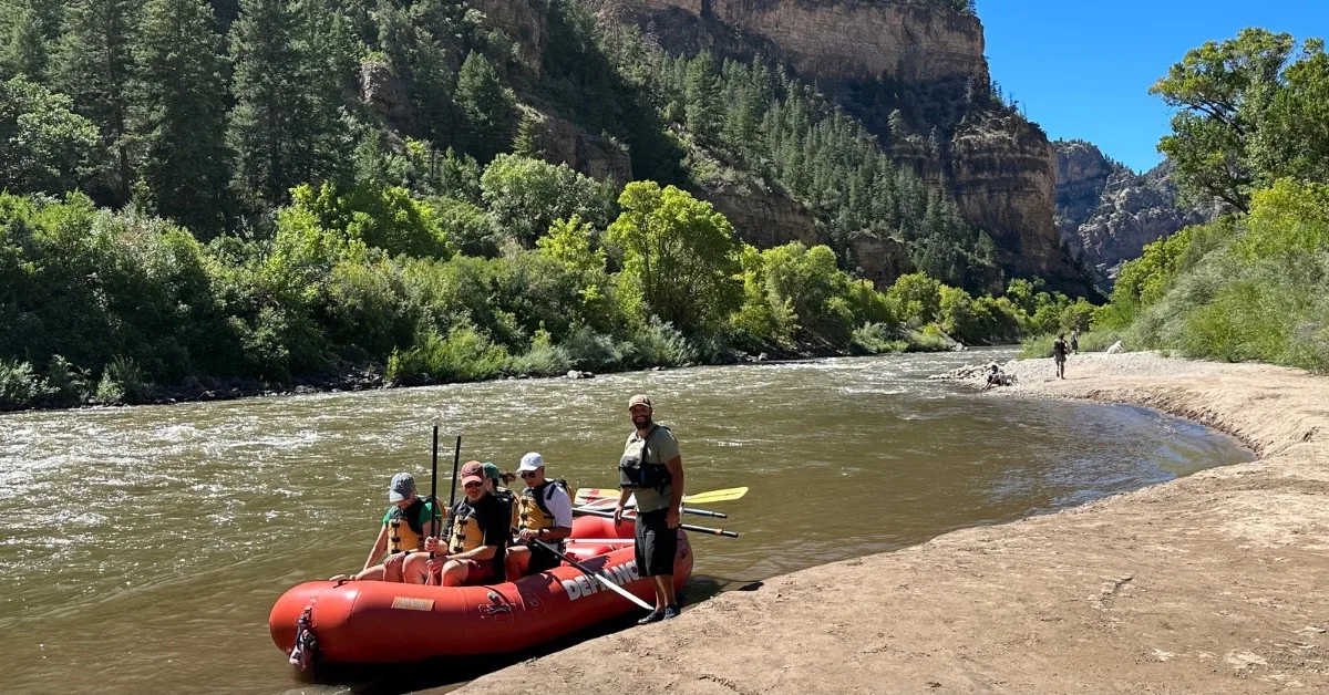 People onboard a raft ready to float a river in Glenwood Caynon.