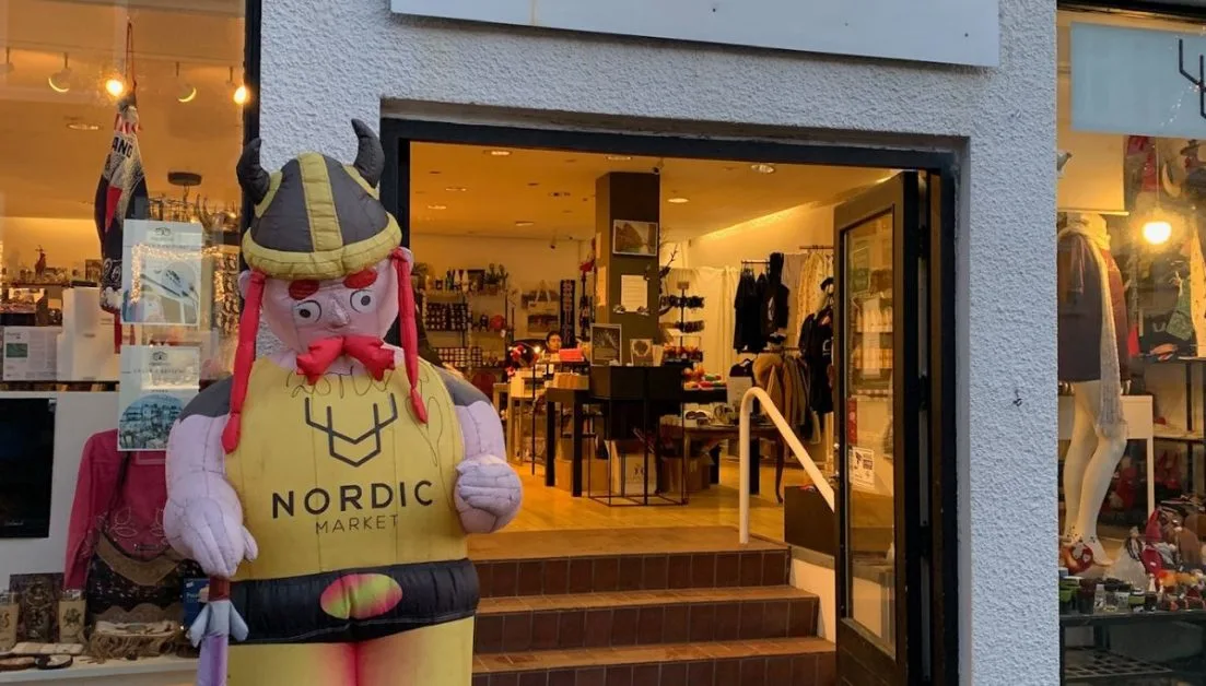 A gift store with viking toy at entrance.