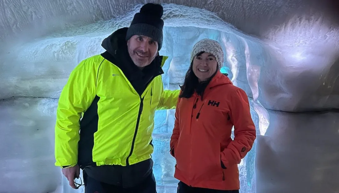 People inside an ice cave.